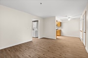 Spacious open-concept living area with modern flooring
