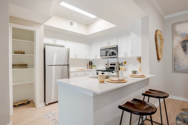 Newly Renovated Kitchen with Breakfast Bar - The Delano at North Richland Hills Apartments