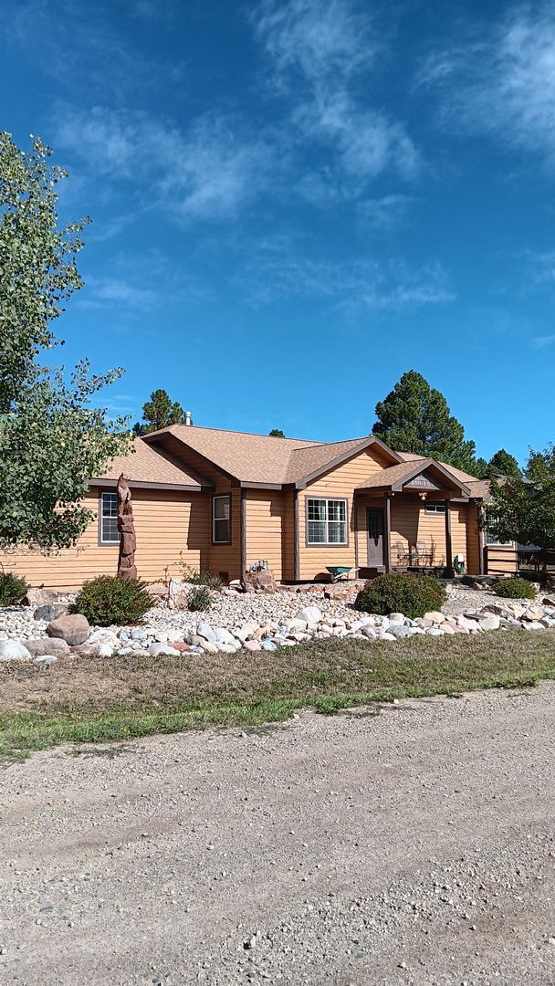 Building Photo - Home on Woodsman