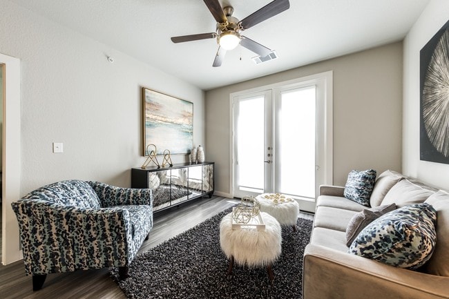 Living room with full-size 3-seated couch, recliner, and cable connections