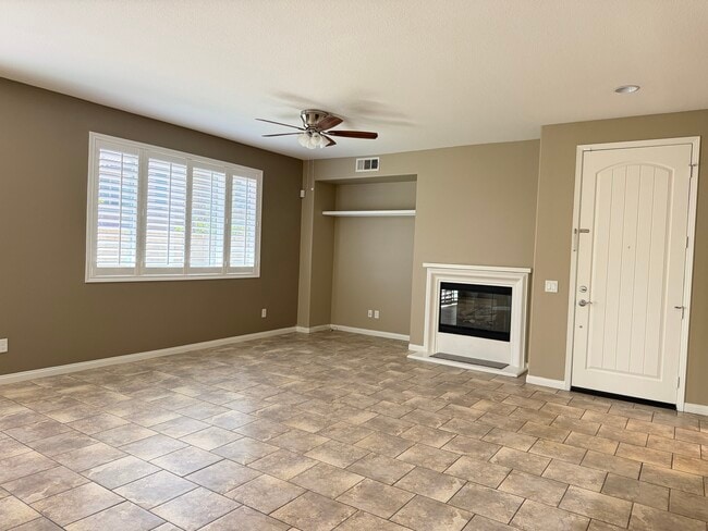 Living room with Plantation shutters - 28377 Mirabelle Ln