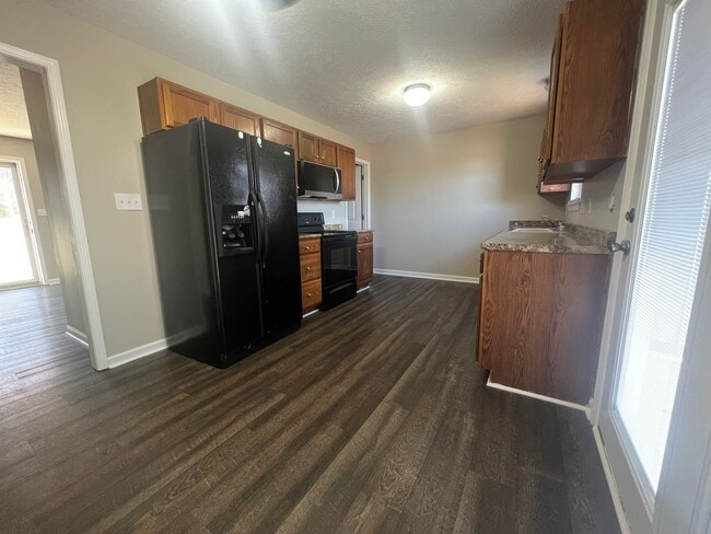 Photo - Four bedroom home in Plum Springs with fully finished basement