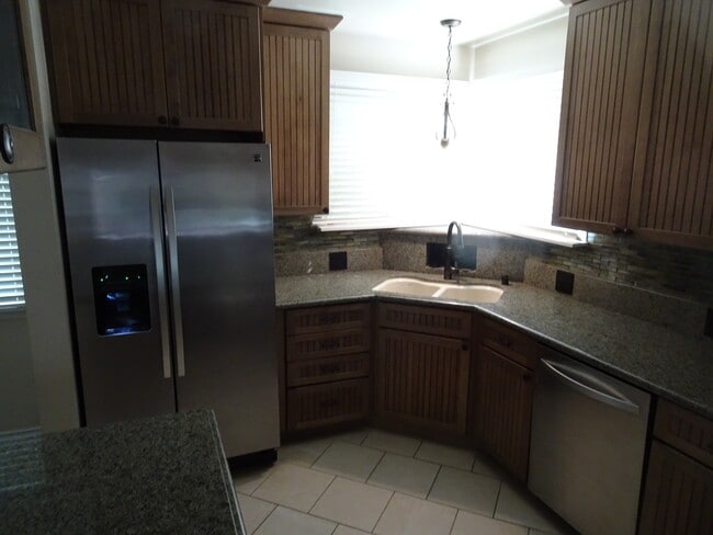 Corner Kitchen Window with Stainless Steel Appliances & Granite Counters - 5643 Cedros Ave