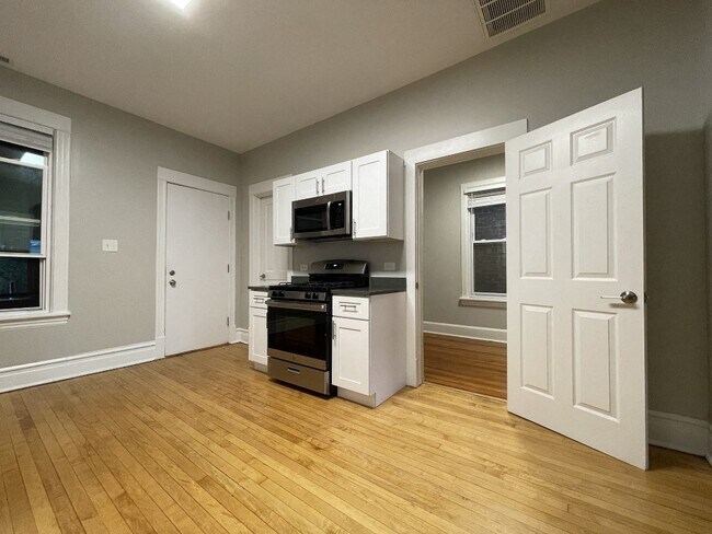 White cabinets and a built-in microwave
