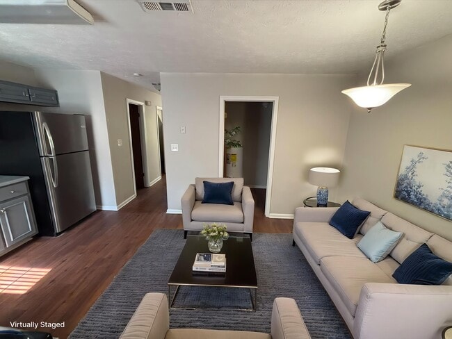 Step into sophistication at Guest House. This inviting living space features modern furnishings, natural light, and stylish decor, creating a seamless blend of comfort and elegance. Explore your new home today!