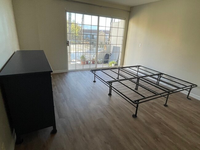 Master Bedroom with Balcony. - 4750 Templeton St Unit 1201