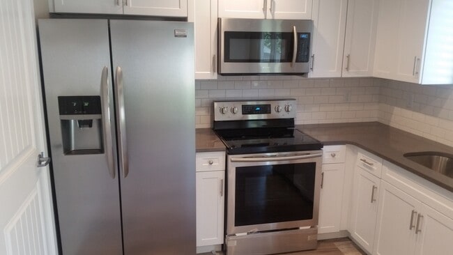 Photo - Beautifully updated town home with fenced backyard.