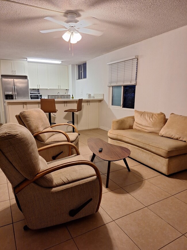Livingroom to kitchen - 411 Kaiolu St Unit 411