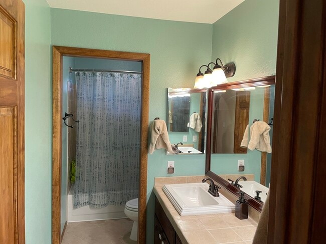Guest bathroom with dual sinks - 3476 S Debbie St