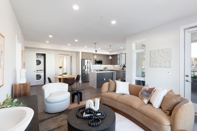 Signature Collection living and dining areas with hard surface flooring throughout