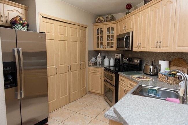 Building Photo - 6276 NW 186th St Unit 215