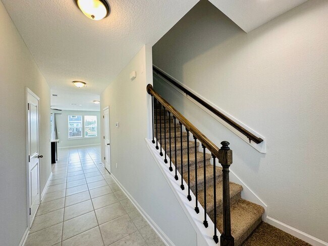Photo - Spacious End Unit with Garage & Loft. Community features High End Amenities!