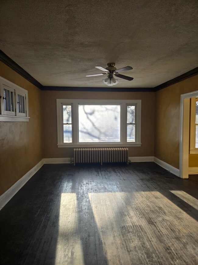 Open Living Room with Bay Window - 716 Elwood Ave N Unit Upper Level