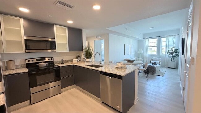 Building Photo - 5587 Millennia Park Dr Unit 210