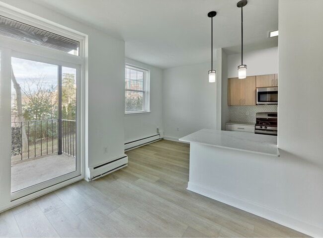 Enjoy natural light, modern finishes, and private balcony access at Crestwood Apartments in Wayne, PA - Crestwood Apartments