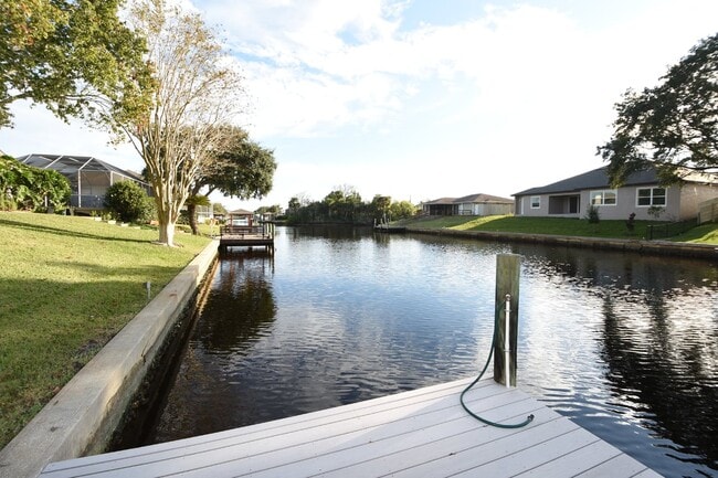 Photo - Salt water canal, 2 story home