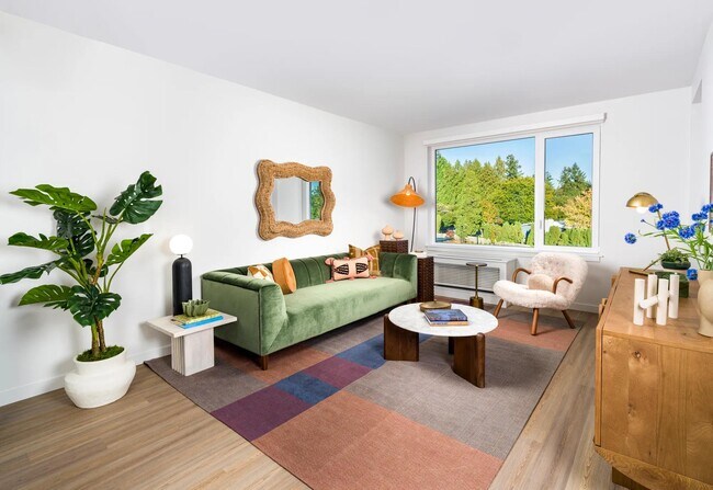 Soaring 9-foot ceilings, wood-style plank flooring, and oversized windows create a bright, open atmosphere that feels as elevated as your lifestyle. - Modera Raleigh Hills