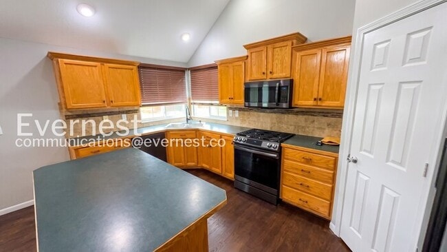 Photo - 5 Bed, 3 Bath Home with Fenced Yard & Garage / Pet-Friendly / Available Now!