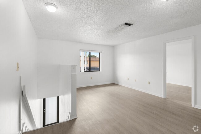 3BR, 2BA - 963SF - Living Room/ Dining Room - Oasis Villas