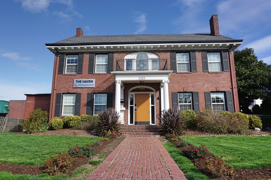 Front of house, standing on Monroe Ave