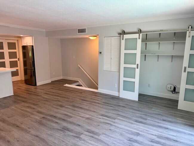 Open living area with built-in storage - 105 4th Ave NE Unit 206