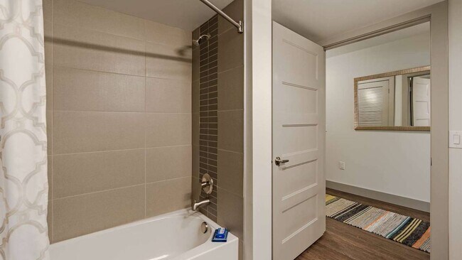 Bathrooms with soaking tubs and curved shower rods