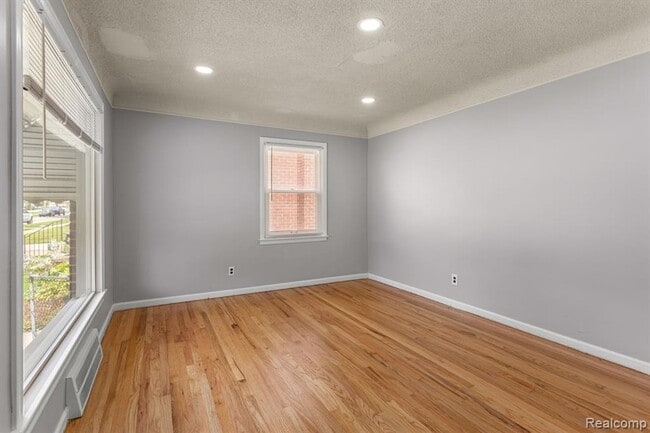 Photo - Cozy & Modern: 2-Bed Brick Home with Garage & Finished Basement