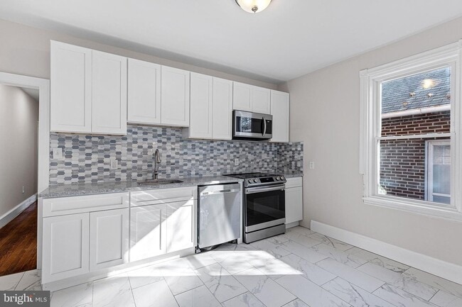 Photo - 102 W 30th St Unit 1