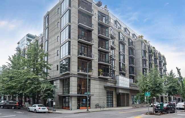 Building Photo - Rare Availability in the Streetcar Lofts, Parking, and Some Utilities Included
