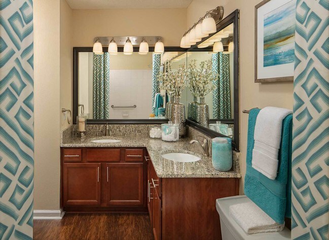 Bathroom with wood style flooring and granite countertops