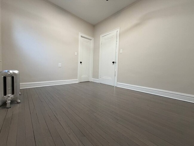 Photo - Spacious 5BR/2BA Home with Basement & Off-Street Parking