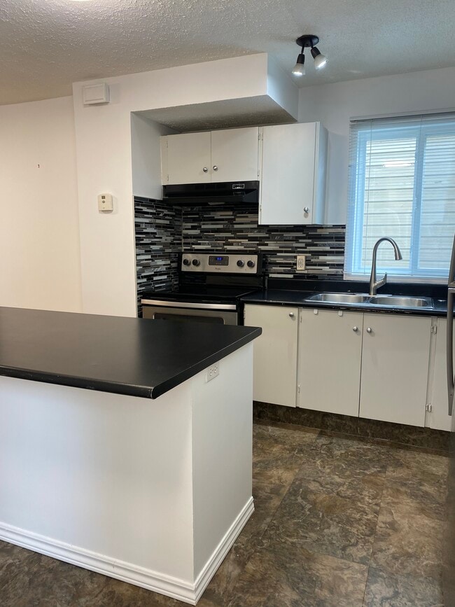 Photo - Charming 3-Bedroom Home with Extra Storage & Outdoor Parking Unit 502
