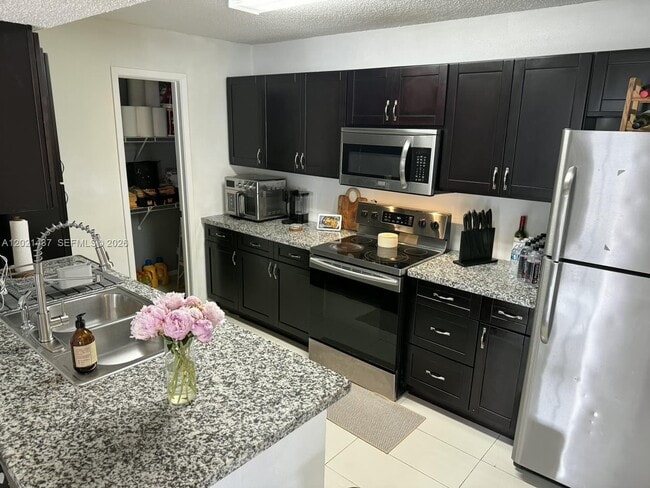 Building Photo - 10360 SW 150th Ct Unit 12209
