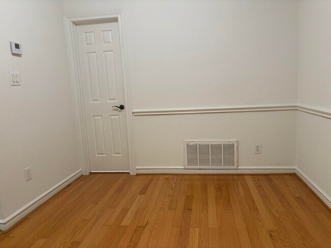 Dining with hardwood floors - 2700 Revere St Unit 112