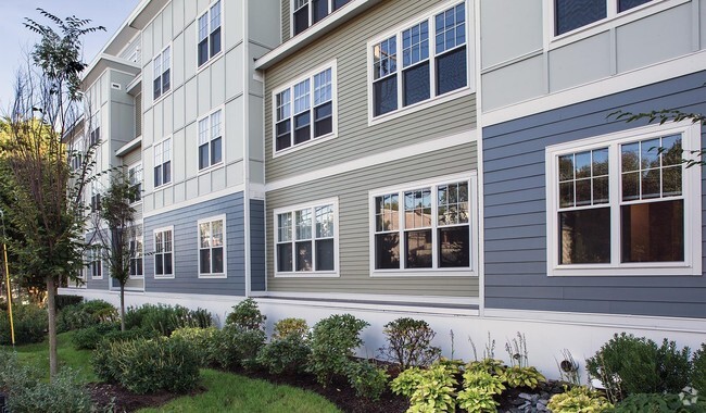 Beautiful landscaping surrounds the community - Charlesbank Apartment Homes