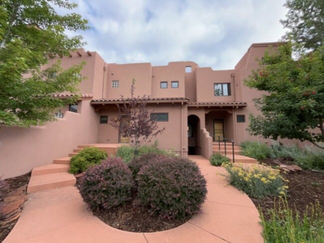 Building Photo - This unique adobe townhome in the heart of...