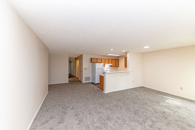 Spacious living room with carpet