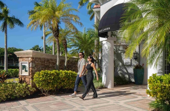 A shaded entrance path creates a clear arrival beside the clubhouse.