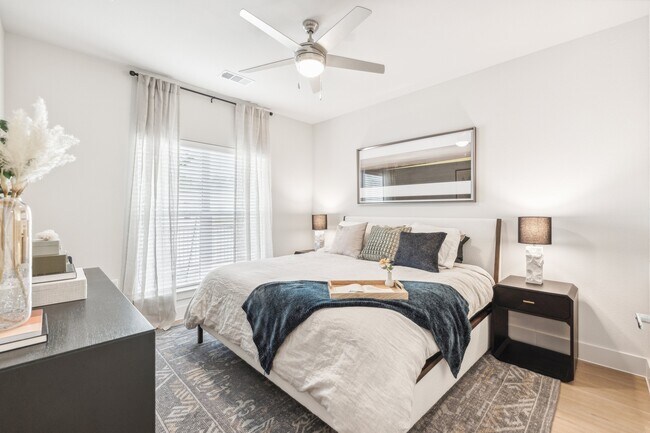 Your Bedroom: Hardwood floors, ceiling fan, and large window