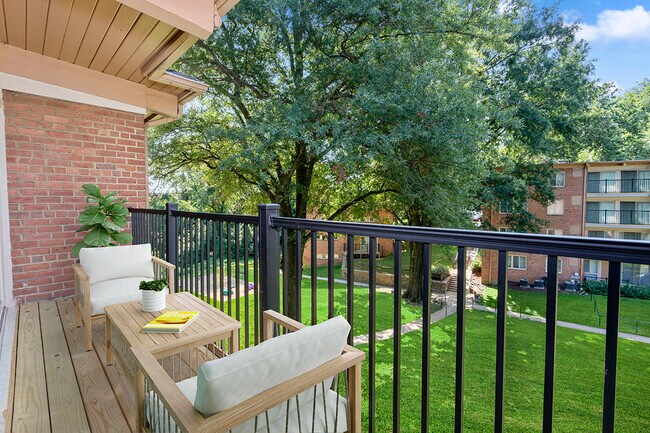 Relaxing covered balcony at Flower Branch Apartments in Silver Spring, MD