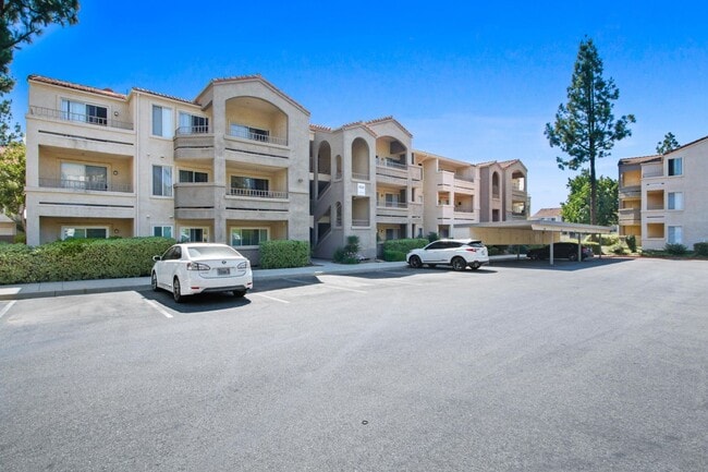 Building Photo - 1BR Condo with Private Balcony, Central A/C & Community Amenities in Corona