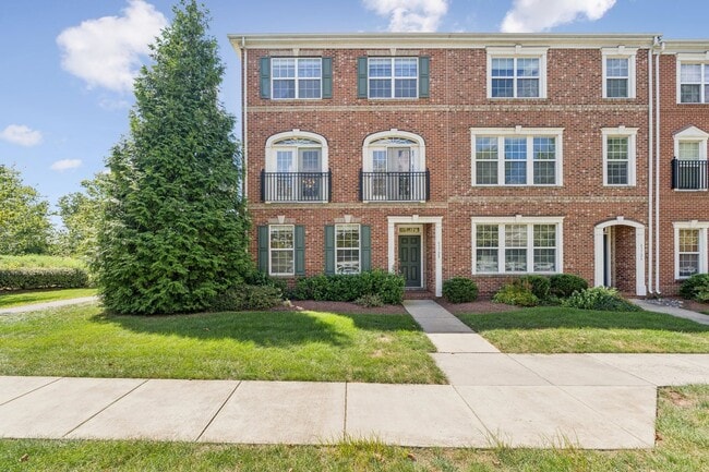 Photo - This beautifully maintained end-unit brick...
