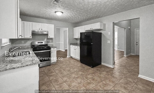 Photo - 3 Bed, 2 Bath Home with Fenced Yard & Garage / Pet-Friendly / Available Now!