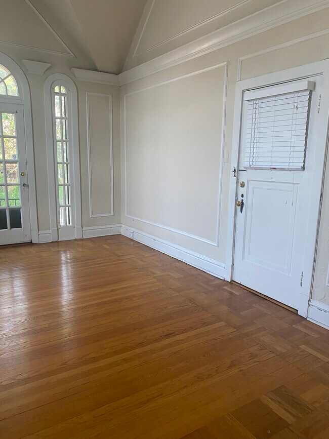 Front door into living room. - 444 S Hanley Rd Unit 2S
