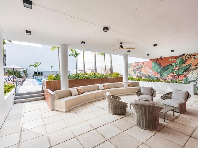 Lounge in comfort with cabanas by the pool, your oasis of relaxation. - Modera St. Petersburg
