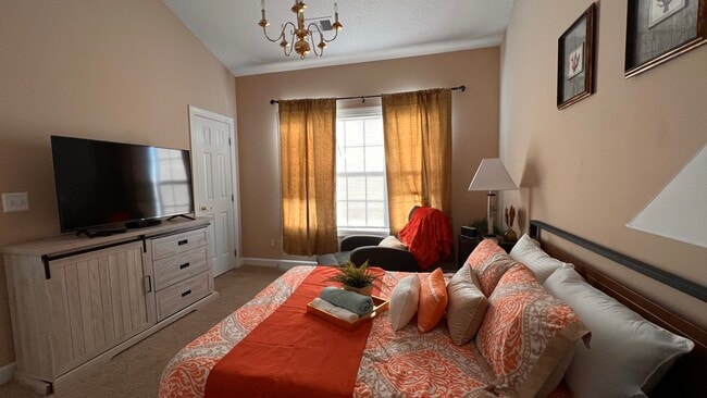 Master bedroom with TV - 3973 Forsythia Ct Unit 303