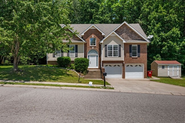 Building Photo - Stunning Stone Fireplace • Finished Basement • Fenced Yard