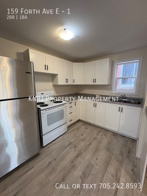 Photo - Two Bedroom Main Floor Apartment Unité 1