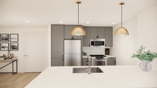 Gather with ease in Modera Bridle Trail's gourmet kitchens, featuring expansive islands, sleek cabinetry, and stainless-steel appliances. - Modera Bridle Trails