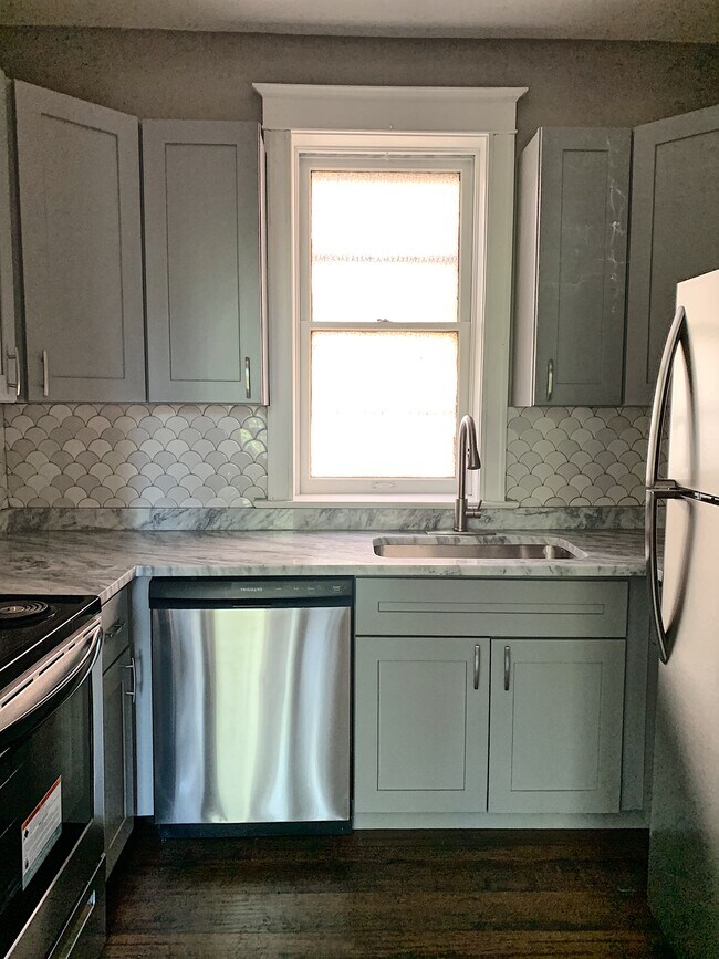 Kitchen with all new stainless steel appliances - 5201 Murdoch Ave Unit A